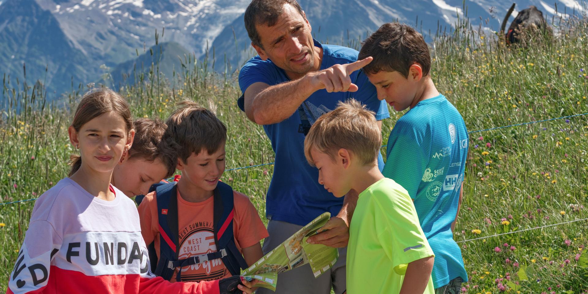 Reading a hiking map in the mountains of Saint-Gervais Mont-Blanc